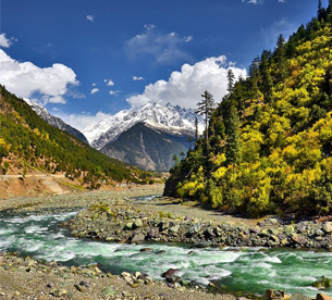 Scenic Swat River flowing through mountains during a Swat Valley family holiday tour