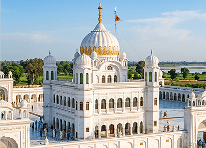Majestic white dome complex of Gurdwara Darbar Sahib Kartarpur representing Sikh pilgrimage tour services in Pakistan